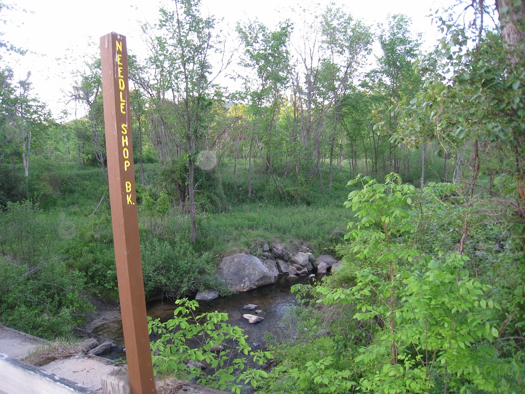 Old Hill Village - South End 440.jpg - In February 1937, residents of Hill Village NH learned that their village, near the Pemigewasset River, was to become a flood control reservoir for the Franklin Falls dam project. To accommodate the construction of the Franklin Falls Dam, the village of Hill NH was to be relocated. By January of 1940, the citizens of Hill NH formed an association, purchased land, and began planning a new model village with the help of the NH State Planning and Development Commission. Construction started in 1940, and by June of 1941 the new town hall and school were completed, along with the streets, water system, and 30 houses. The 1941 town meeting was called to order in the old town hall, recessed, and reconvened in the new village.